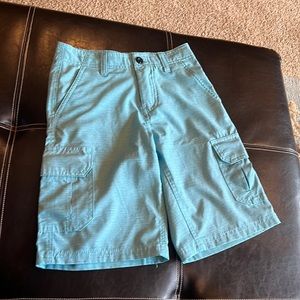 Light blue casual shorts.